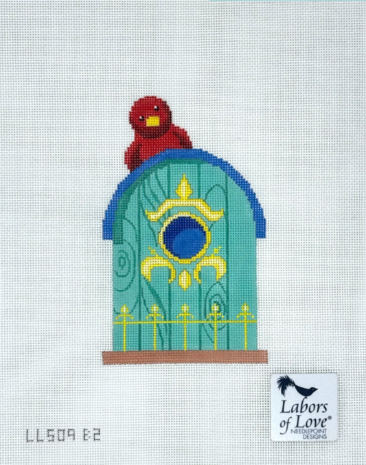Turquoise Birdhouse with Red Bird